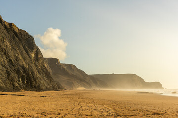 Wall Mural - Cordoama Beach in Portugal. Atlantic Ocean and rocky cliffs at sandy beach