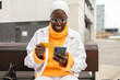 © ADDICTIVE STOCK - Smiling woman shopping online with card and phone