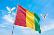 Waving flag of Mali in beautiful sky and flying pigeons. Mali flag for independence day. The symbol of the state on wavy fabric.