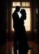Silhouette of a couple dancing in a ballroom, with a focus on the elegance of the dance.