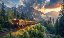 Modern Train Driving On Railroad Tracks Between Coniferous Trees And Mountains Under Sky During Summer Day