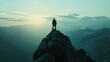 A person standing on the peak of a mountain. Suitable for adventure and success concepts