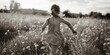 A little girl joyfully running through a vibrant field of flowers. Ideal for spring or summer concepts