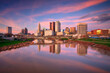 Columbus, Ohio, USA. Cityscape image of Columbus , Ohio, USA downtown skyline with the reflection of the city in the Scioto River at spring sunset.