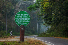 A Road Side Sign Board Mentioning The Maximum Seed Limit Written In Bengali Language.