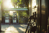 Fototapeta Most - Fuel nozzle or fuel dispenser in gas station, one of the world's most traded commodities and vital to the economy, increase and decrease in oil prices, demand supply in oil