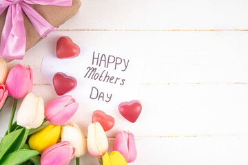 Sticker - Mother day background with tulip flowers bouquet, gift box with pink ribbon and Happy Mother Day tag. Greeting card background, flat lay for poster, brochures, booklets, promotional materials, website