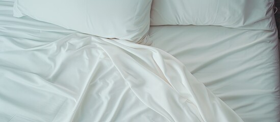 Sticker - A cozy bed in the bedroom with white linens, patterned duvet, and soft pillows for ultimate comfort. It feels like sleeping in your favorite tshirt sleeve