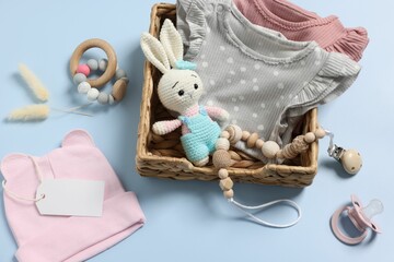 Canvas Print - Flat lay composition with different baby accessories on light blue background