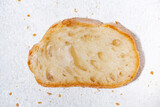 Fototapeta Mapy - slice of baguette on a white background
