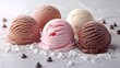 Scoops of ice cream in strawberry, chocolate, and vanilla flavors dusted with powdered sugar