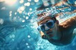An underwater shot captures a focused swimmer wearing goggles