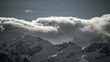 strong south wind and foehn clouds in the alps at a sunny spring day in the national park hohe tauern in austria