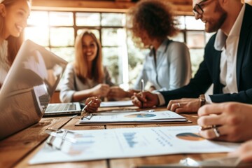 Wall Mural - A diverse group of individuals sitting together and engaging in conversation around a sturdy wooden table, A business team concluding a meeting after applying for a transaction loan, AI Generated