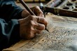 A person is seen in the photo, writing on a piece of paper with a pen, A calligrapher crafting intricate Arabic script, AI Generated