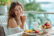 © Татьяна Евдокимова - Radiant young lady with a delightful smile having a healthy morning meal outdoors