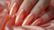 Woman hand with glamour shiny peach color nail polish on fingernails. Holiday style bright Manicure