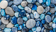 © hardvicore - Pile of blue and gray pebble glossy stones. Colorful smooth rocks. Abstract natural background.