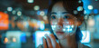 Concept of staying current with technology in today's fast-paced world. An Asian woman uses a holographic display to view her phone data and functions.