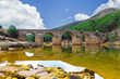 Roman bridge in the hiking route of the water mills along the Odiel river from Sotiel Coronada, in Huelva province, Andalusia, Spain