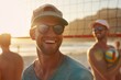 © Татьяна Евдокимова - Smiling young man in cap and sunglasses with friends playing volleyball on the beach