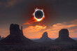 Total solar eclipse and Monument Valley at sunrise