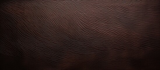 Sticker - A close up of a dark brown leather texture with shades resembling wood flooring. The pattern of the leather forms a circle, giving it a unique and luxurious look