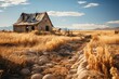 An old abandoned house stands lonely in a vast grassland under a clear sky
