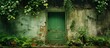 A green door is nestled within a lush natural landscape of plants and trees alongside a building facade, creating a serene and inviting entrance