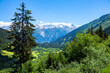 Scenic summer mountain landscape of Swiss Alps with green hillsides, valleys and highland pastures, canton of Grisons