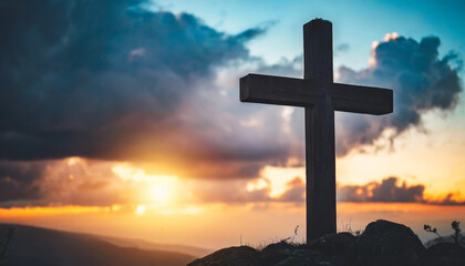 Silhouette of Holy Cross against dramatic sky, symbolizing Jesus Christ's death and resurrection