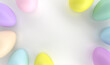 Holiday Easter background of colorful pastel Easter eggs and bunny ears on white table top view