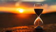 Hourglass on sunset backdrop symbolizing fleeting time, life's value, and urgency
