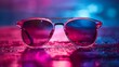 Stylish sunglasses shot using pink and blue abstract colored lighting
