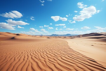 Wall Mural - A natural landscape of sand dunes under a blue sky with fluffy cumulus clouds