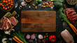 Empty wooden cutting board with fresh vegetables and meat around, top view. Food background.