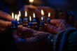 Individuals holding illuminated candles in their hands as part of a group ceremony for Hanukkah Menorah lighting