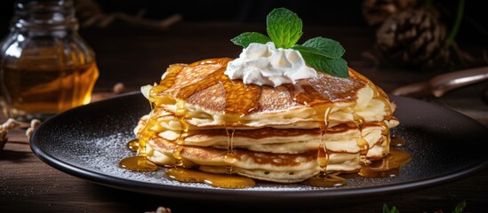 Wall Mural - Indulgent Breakfast Delight: Stack of Fluffy Pancakes Drizzled with Syrup and Whipped Cream