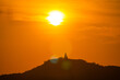 scenery yellow sky glare of sun above Phuket big Buddha.Phuket Big Buddha is one of the island most important and revered landmarks on the island..image for travel and culture concept..