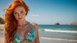 a beautiful woman with blue eyes and red hair wearing a bikini at the sunny beach