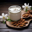 Natural cream cosmetic of almonds nuts on wooden backgrounds