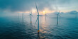 © Planetz - electricity wind turbine on blue sea with blue sky with foggy weather, offshore wind farm,