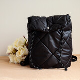Fototapeta  - Fashion Ladies Bags Black Quilted. Backpack background