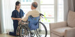 © chokniti - asian woman doctor nursing home to helping take care to retirement patient who sitting on wheelchair, caregiver nurse support to medical health care insurance at home or hospital, elderly senior man