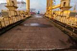 Fototapeta Las - the quay of the ship repair yard including cranes
