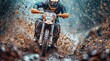 Motocross rider in action on a muddy road. Extreme motocross sport.
