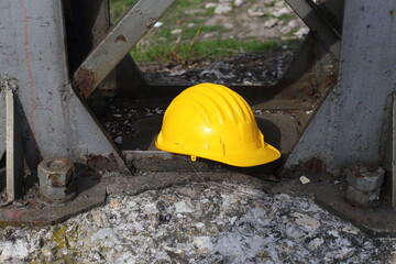 Wall Mural - yellow helmet on a work site