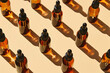 Amber Glass Dropper Bottles Arranged on Neutral Background