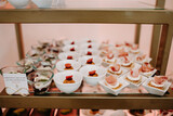 Fototapeta Pomosty - Luxury event - finger foods served on elegant plates