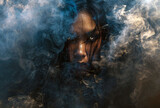 Fototapeta Sypialnia - her face is hidden in the dense smoke